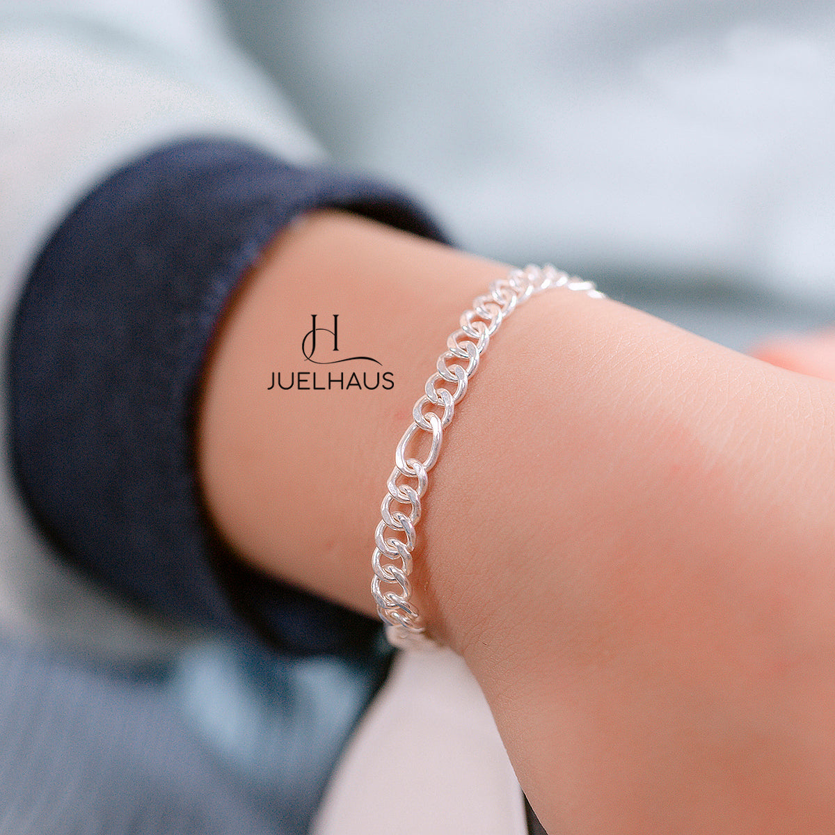 JUELHAUS Silver Baby Bracelets with Stylized Single String Bells Interspersed with Long Round Eyes