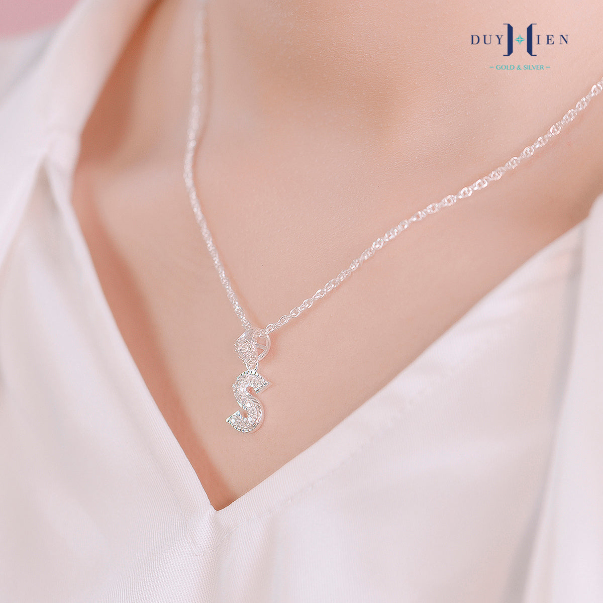 JUELHAUS Silver pendant given to a girlfriend in the shape of a letter with a stone on a hook, strikingly impressive