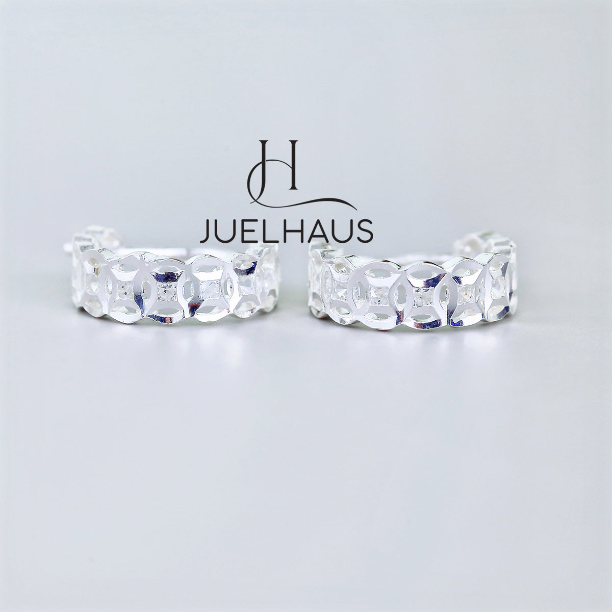 JUELHAUS Silver Earrings for Children, Non-Round Shaped with Sparkling Milled Money