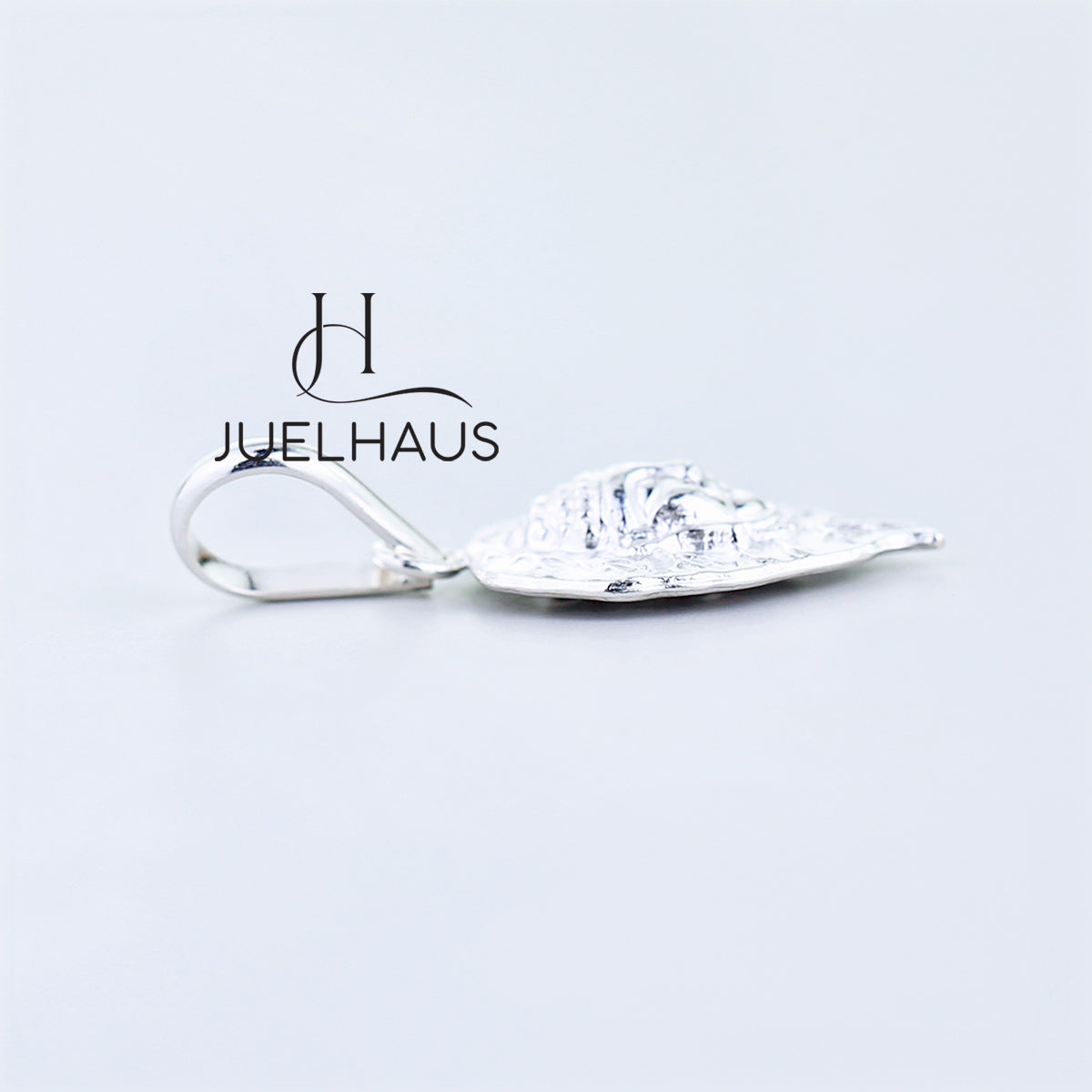 JUELHAUS Silver Pendant with Bodhi Leaf Shaped on one side engraved with Zen words and on the other side has an embossed Buddha head