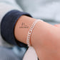 JUELHAUS  Silver Baby Bracelets with Stylized Single String Bells Interspersed with Long Round Eyes