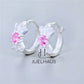 JUELHAUS Silver Earrings for Babies in Round Bow Shape with 2 Excellently Beautiful Crystal Shapes