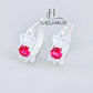 JUELHAUS Silver Earrings for Babies in Round Bow Shape with 2 Excellently Beautiful Crystal Shapes