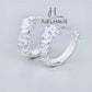 JUELHAUS Simple but extremely bright white single row white stone earrings, non-round style with extremely sturdy clasp