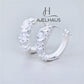 JUELHAUS Simple but extremely bright white single row white stone earrings, non-round style with extremely sturdy clasp