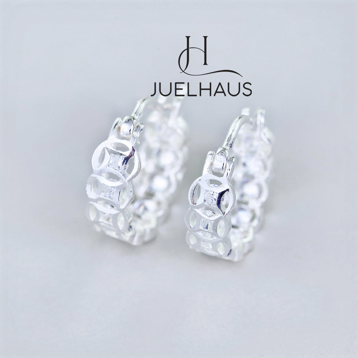 JUELHAUS Silver Earrings for Children, Non-Round Shaped with Sparkling Milled Money