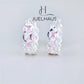 JUELHAUS Silver Earrings for Children, Non-Round Shaped with Sparkling Milled Money