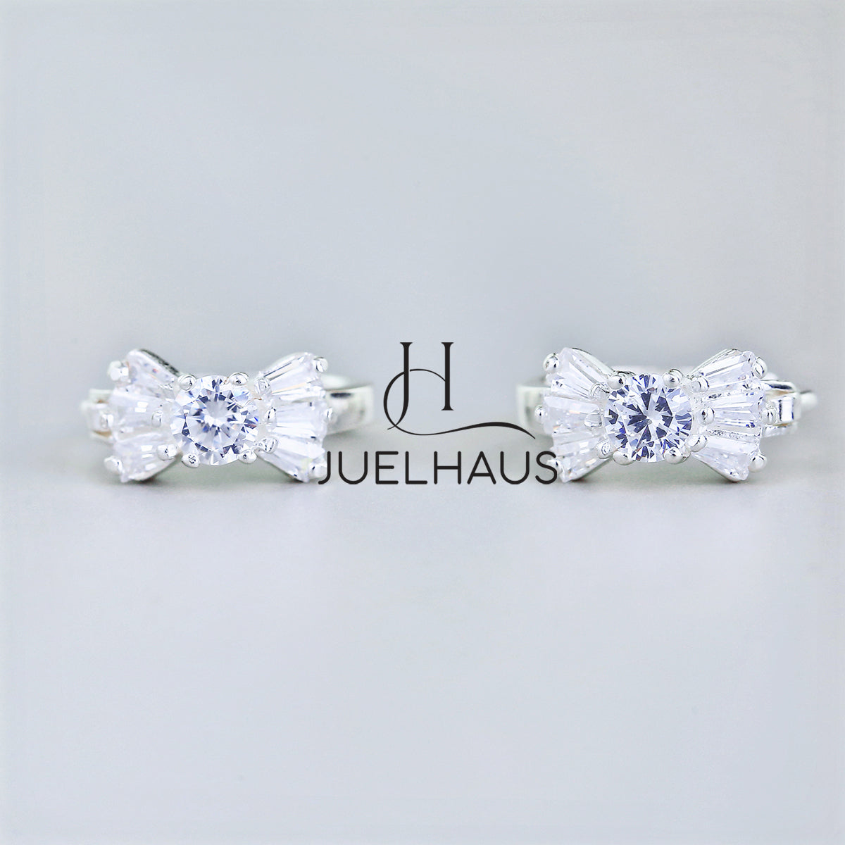 JUELHAUS Silver Earrings for Babies in Round Bow Shape with 2 Excellently Beautiful Crystal Shapes
