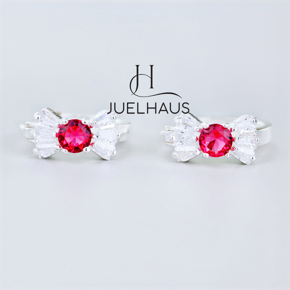 JUELHAUS Silver Earrings for Babies in Round Bow Shape with 2 Excellently Beautiful Crystal Shapes