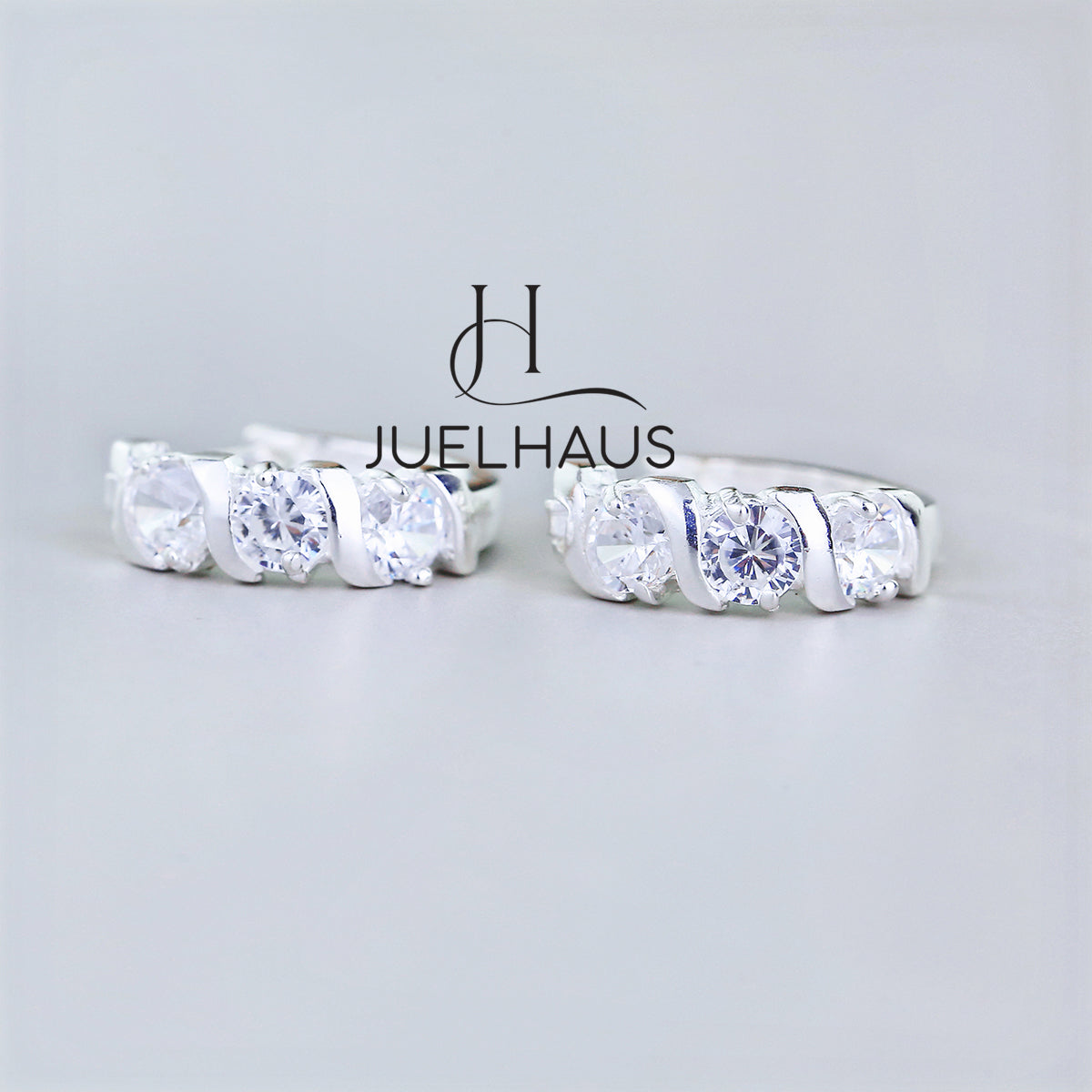 JUELHAUS Simple but extremely bright white single row white stone earrings, non-round style with extremely sturdy clasp