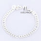 JUELHAUS  Silver Baby Bracelets with Stylized Single String Bells Interspersed with Long Round Eyes