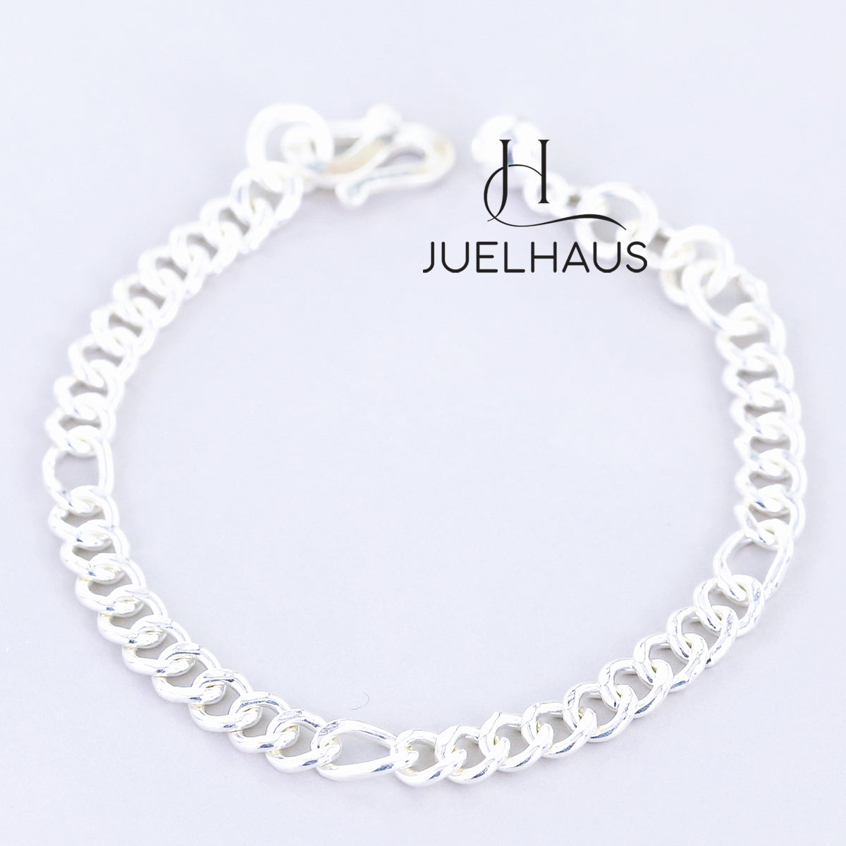 JUELHAUS  Silver Baby Bracelets with Stylized Single String Bells Interspersed with Long Round Eyes