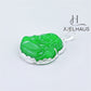 JUELHAUS Silver Pendant With Image Of Laughing Buddha, Green Jade Stone, Smooth Silver Border