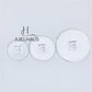 JUELHAUS Smooth, wind-scraped silver coins come in many sizes