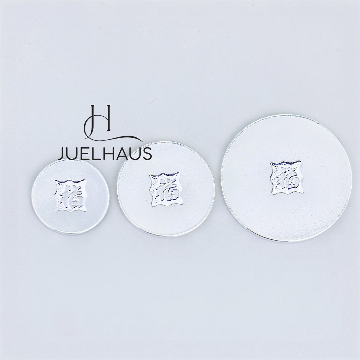 JUELHAUS Smooth, wind-scraped silver coins come in many sizes