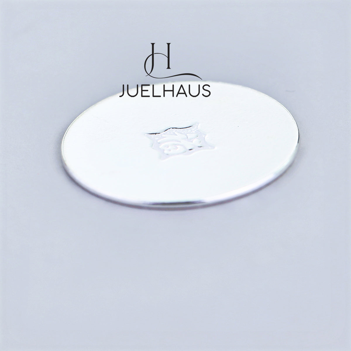 JUELHAUS Smooth, wind-scraped silver coins come in many sizes