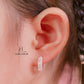 JUELHAUS Simple but extremely bright white single row white stone earrings, non-round style with extremely sturdy clasp
