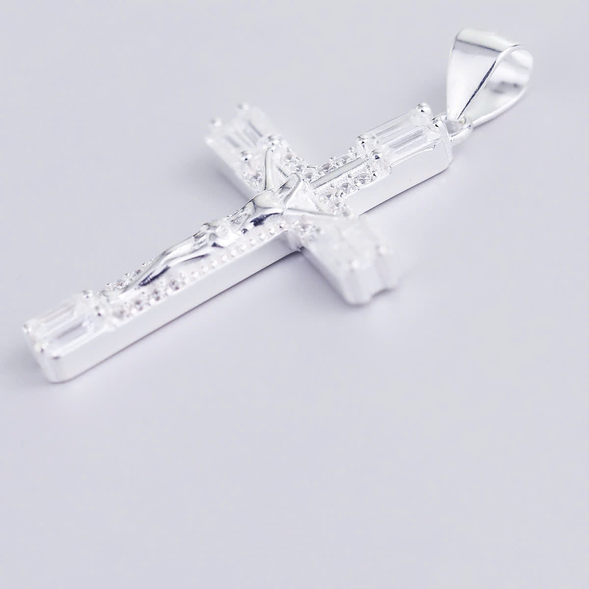 JUELHAUS S990 Pure Silver Cross Pendant With Luxurious 4-Headed Baguette Stone Jesus Statue